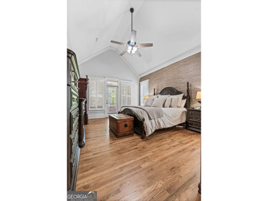 Experience panoramic views of the lake and golf course in this on Summergrove Golf Club in Georgia - for sale on GolfHomes.com, golf home, golf lot