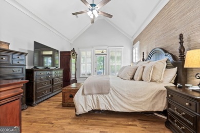 Experience panoramic views of the lake and golf course in this on Summergrove Golf Club in Georgia - for sale on GolfHomes.com, golf home, golf lot