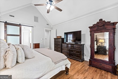 Experience panoramic views of the lake and golf course in this on Summergrove Golf Club in Georgia - for sale on GolfHomes.com, golf home, golf lot