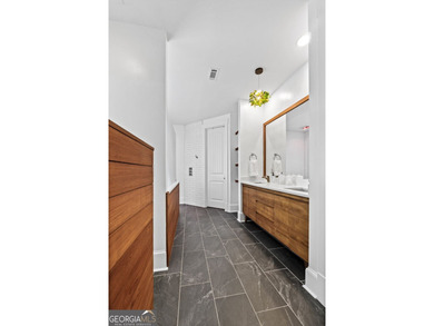 Experience panoramic views of the lake and golf course in this on Summergrove Golf Club in Georgia - for sale on GolfHomes.com, golf home, golf lot