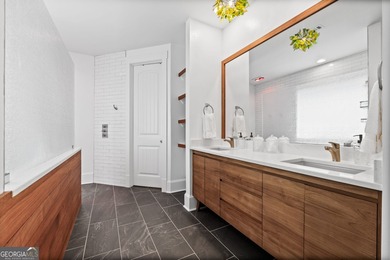 Experience panoramic views of the lake and golf course in this on Summergrove Golf Club in Georgia - for sale on GolfHomes.com, golf home, golf lot