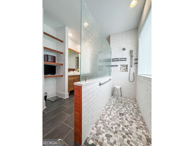 Experience panoramic views of the lake and golf course in this on Summergrove Golf Club in Georgia - for sale on GolfHomes.com, golf home, golf lot