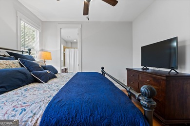 Experience panoramic views of the lake and golf course in this on Summergrove Golf Club in Georgia - for sale on GolfHomes.com, golf home, golf lot