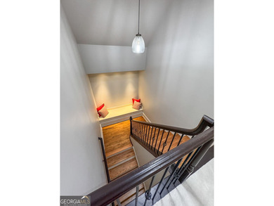 Experience panoramic views of the lake and golf course in this on Summergrove Golf Club in Georgia - for sale on GolfHomes.com, golf home, golf lot