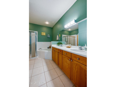 This beautifully maintained 2-bedroom, 2-bathroom single-level on LPGA International Golf Course in Florida - for sale on GolfHomes.com, golf home, golf lot
