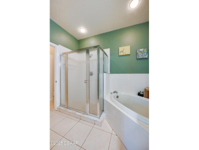 This beautifully maintained 2-bedroom, 2-bathroom single-level on LPGA International Golf Course in Florida - for sale on GolfHomes.com, golf home, golf lot