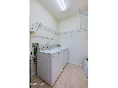 This beautifully maintained 2-bedroom, 2-bathroom single-level on LPGA International Golf Course in Florida - for sale on GolfHomes.com, golf home, golf lot