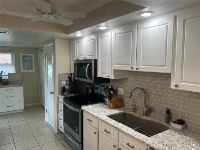 VILLA with TRANQUIL GOLF COURSE VIEWS IN EAST LAKE WOODLANDS on East Lake Woodlands Country Club in Florida - for sale on GolfHomes.com, golf home, golf lot