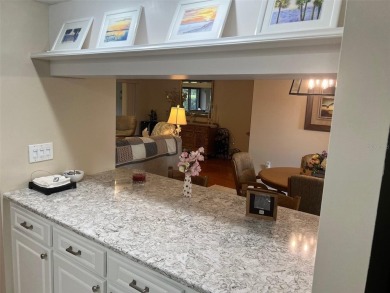 VILLA with TRANQUIL GOLF COURSE VIEWS IN EAST LAKE WOODLANDS on East Lake Woodlands Country Club in Florida - for sale on GolfHomes.com, golf home, golf lot
