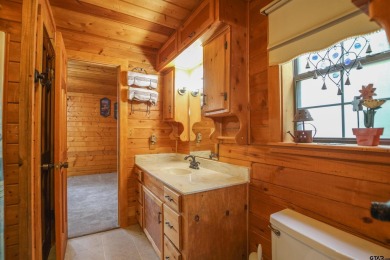 Nestled in the heart of the highly sought-after Holly Lake Ranch on Holly Lake Ranch Golf Club in Texas - for sale on GolfHomes.com, golf home, golf lot