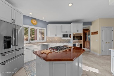 Immaculate golf-front home perfectly positioned on the 12th on Pinewild Country Club of Pinehurst in North Carolina - for sale on GolfHomes.com, golf home, golf lot