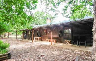 Nestled in the heart of the highly sought-after Holly Lake Ranch on Holly Lake Ranch Golf Club in Texas - for sale on GolfHomes.com, golf home, golf lot
