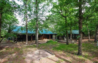 Nestled in the heart of the highly sought-after Holly Lake Ranch on Holly Lake Ranch Golf Club in Texas - for sale on GolfHomes.com, golf home, golf lot