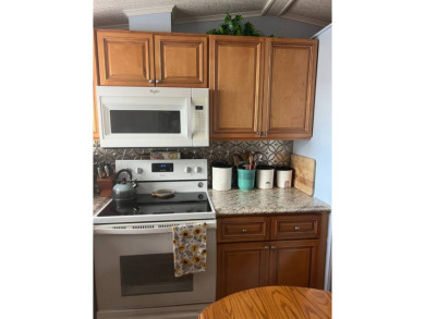 PRICE DROP! Welcome to this charming well maintained and on Lake Henry Golf Club in Florida - for sale on GolfHomes.com, golf home, golf lot