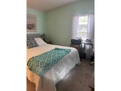 PRICE DROP! Welcome to this charming well maintained and on Lake Henry Golf Club in Florida - for sale on GolfHomes.com, golf home, golf lot