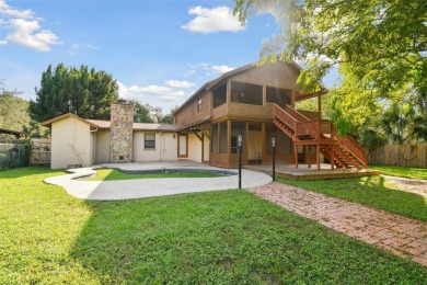 This lovely home in Forest Hills comes with its own fish, flower on Babe Zaharias Golf Course in Florida - for sale on GolfHomes.com, golf home, golf lot