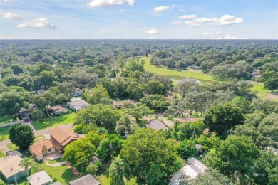 This lovely home in Forest Hills comes with its own fish, flower on Babe Zaharias Golf Course in Florida - for sale on GolfHomes.com, golf home, golf lot