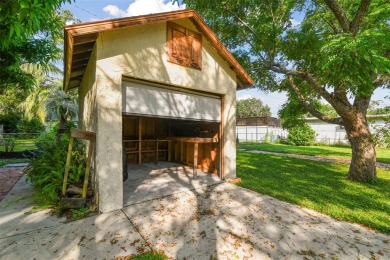 This lovely home in Forest Hills comes with its own fish, flower on Babe Zaharias Golf Course in Florida - for sale on GolfHomes.com, golf home, golf lot