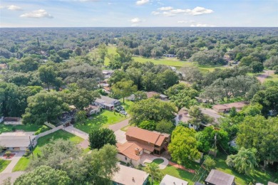 This lovely home in Forest Hills comes with its own fish, flower on Babe Zaharias Golf Course in Florida - for sale on GolfHomes.com, golf home, golf lot