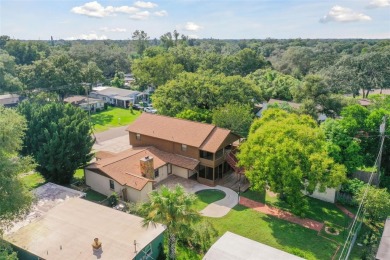 This lovely home in Forest Hills comes with its own fish, flower on Babe Zaharias Golf Course in Florida - for sale on GolfHomes.com, golf home, golf lot