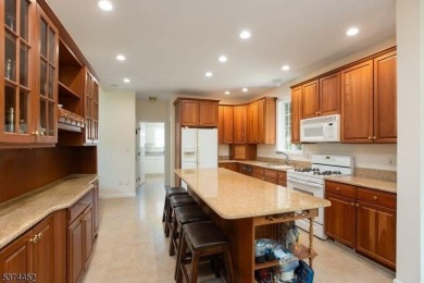 Welcome to this sun-filled 4-bedroom Colonial backing to the on Warrenbrook Golf Course in New Jersey - for sale on GolfHomes.com, golf home, golf lot