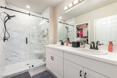 Impeccable, upgrade-rich, and truly move-in ready-this lakefront on Herons Glen Golf and Country Club in Florida - for sale on GolfHomes.com, golf home, golf lot