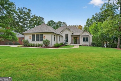 Welcome to your dream home, where timeless European charm meets on Reynolds Lake Oconee - The Landing in Georgia - for sale on GolfHomes.com, golf home, golf lot
