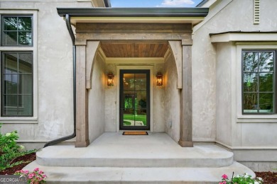 Welcome to your dream home, where timeless European charm meets on Reynolds Lake Oconee - The Landing in Georgia - for sale on GolfHomes.com, golf home, golf lot