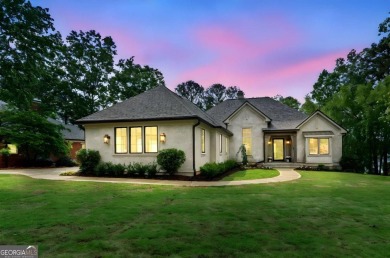 Welcome to your dream home, where timeless European charm meets on Reynolds Lake Oconee - The Landing in Georgia - for sale on GolfHomes.com, golf home, golf lot