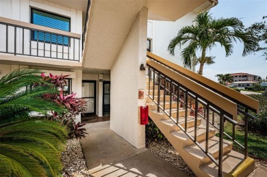 Tastefully remodeled in 2022 with high-end finishes, this ground on Isla Del Sol Yacht and Country Club in Florida - for sale on GolfHomes.com, golf home, golf lot