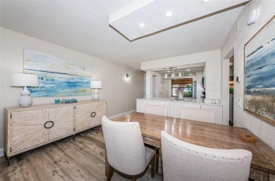 Tastefully remodeled in 2022 with high-end finishes, this ground on Isla Del Sol Yacht and Country Club in Florida - for sale on GolfHomes.com, golf home, golf lot