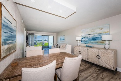 Tastefully remodeled in 2022 with high-end finishes, this ground on Isla Del Sol Yacht and Country Club in Florida - for sale on GolfHomes.com, golf home, golf lot