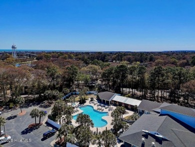 This third floor Royal Poste golf front condo in the vibrant on Sea Trail Golf Resort in North Carolina - for sale on GolfHomes.com, golf home, golf lot