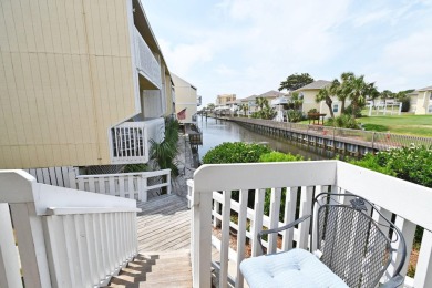 Experience coastal living at its finest in this beautifully on Sandpiper Cove Golf Course in Florida - for sale on GolfHomes.com, golf home, golf lot