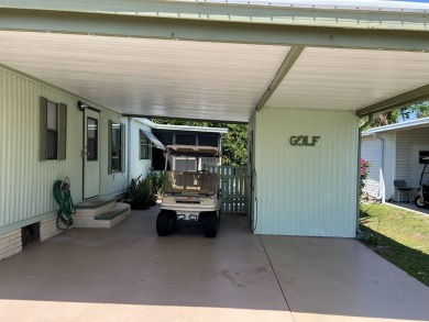 Welcome to this cozy and inviting home perfectly situated on a on Lake Henry Golf Club in Florida - for sale on GolfHomes.com, golf home, golf lot