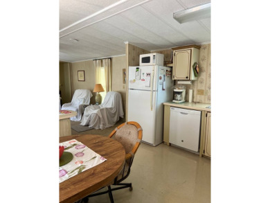 Welcome to this cozy and inviting home perfectly situated on a on Lake Henry Golf Club in Florida - for sale on GolfHomes.com, golf home, golf lot