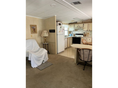 Welcome to this cozy and inviting home perfectly situated on a on Lake Henry Golf Club in Florida - for sale on GolfHomes.com, golf home, golf lot