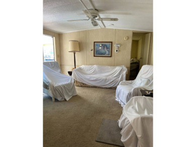 Welcome to this cozy and inviting home perfectly situated on a on Lake Henry Golf Club in Florida - for sale on GolfHomes.com, golf home, golf lot