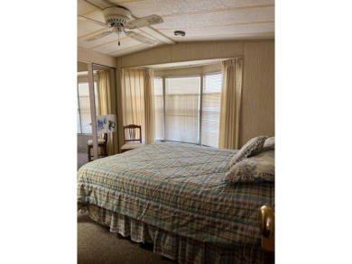Welcome to this cozy and inviting home perfectly situated on a on Lake Henry Golf Club in Florida - for sale on GolfHomes.com, golf home, golf lot
