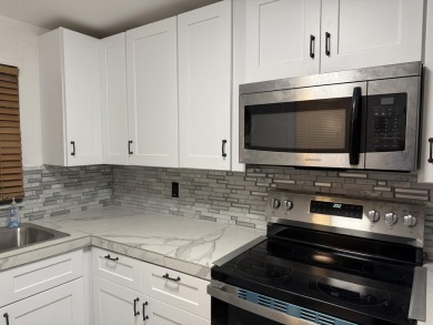 This well-maintained first-floor unit offers a great combination on Pine Island Ridge Country Club in Florida - for sale on GolfHomes.com, golf home, golf lot