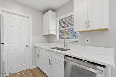 Move right into this thoughtfully updated 2 bedroom, 1.5 on Oak Hills Country Club in Florida - for sale on GolfHomes.com, golf home, golf lot