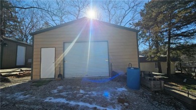 Welcome to your serene lakeside retreat! This beautiful property on Sugar Valley Lakes Golf Course in Kansas - for sale on GolfHomes.com, golf home, golf lot