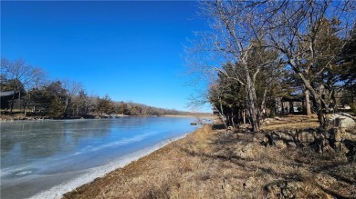 Welcome to your serene lakeside retreat! This beautiful property on Sugar Valley Lakes Golf Course in Kansas - for sale on GolfHomes.com, golf home, golf lot