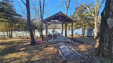 Welcome to your serene lakeside retreat! This beautiful property on Sugar Valley Lakes Golf Course in Kansas - for sale on GolfHomes.com, golf home, golf lot