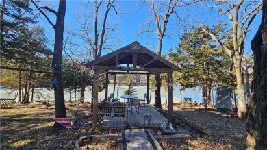 Welcome to your serene lakeside retreat! This beautiful property on Sugar Valley Lakes Golf Course in Kansas - for sale on GolfHomes.com, golf home, golf lot