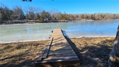 Welcome to your serene lakeside retreat! This beautiful property on Sugar Valley Lakes Golf Course in Kansas - for sale on GolfHomes.com, golf home, golf lot