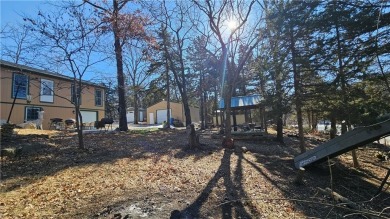 Welcome to your serene lakeside retreat! This beautiful property on Sugar Valley Lakes Golf Course in Kansas - for sale on GolfHomes.com, golf home, golf lot