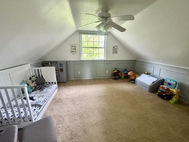 Nestled on two spacious lots totaling 0.79 acres with just one on Sugar Springs Country Club in Michigan - for sale on GolfHomes.com, golf home, golf lot