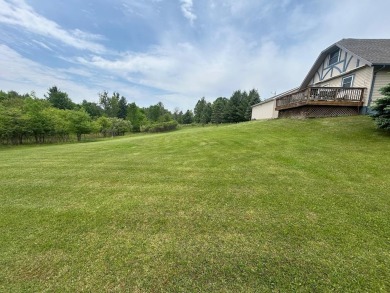 Nestled on two spacious lots totaling 0.79 acres with just one on Sugar Springs Country Club in Michigan - for sale on GolfHomes.com, golf home, golf lot