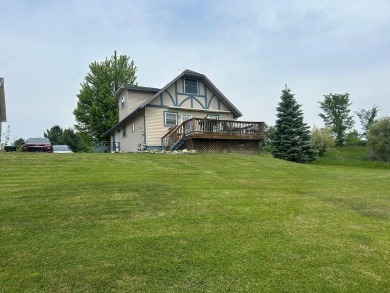 Nestled on two spacious lots totaling 0.79 acres with just one on Sugar Springs Country Club in Michigan - for sale on GolfHomes.com, golf home, golf lot